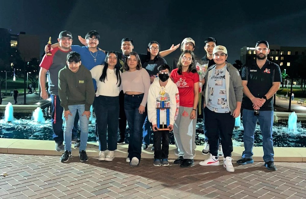 group of students and sponsors posing with Chess trophy