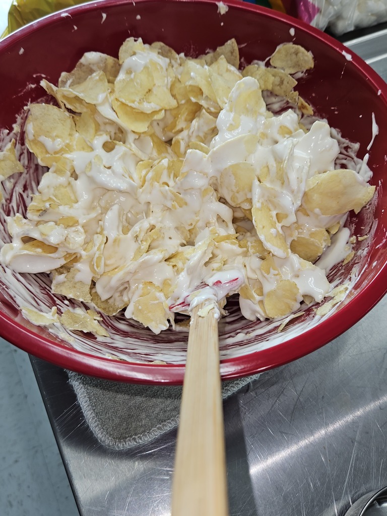 bowl of potato chips mixed with melting marshmallow